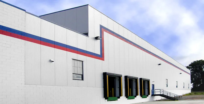 Finished exterior of the Ace Stamping industrial addition with loading docks