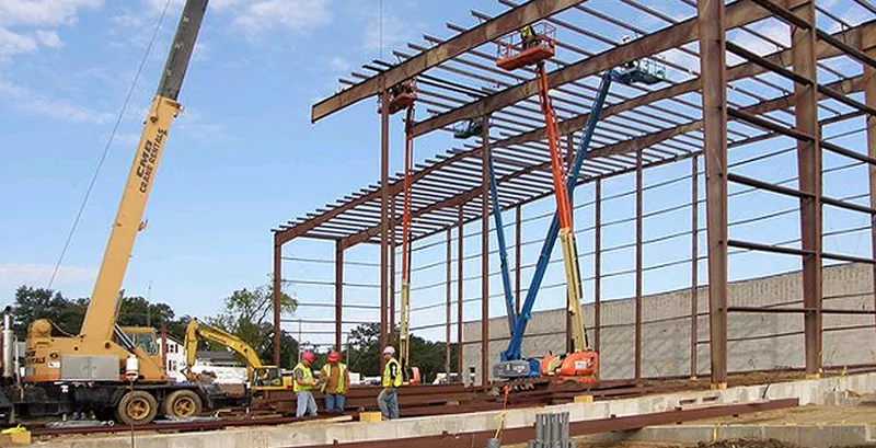Crane and lifts erecting the steel frame of the Echo Lake Foods Yorkville addition