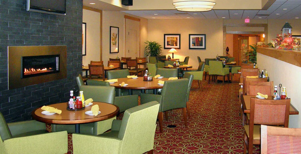 Redesigned Marriott 20 & Oaks restaurant dining room with gas fireplace