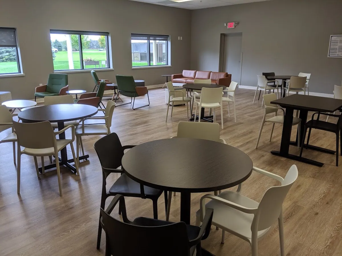 Renovated Lakeside Curative Services cafeteria with round tables