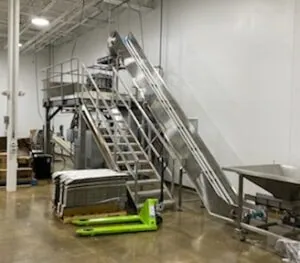 Stainless steel food processing conveyor in the new buildout