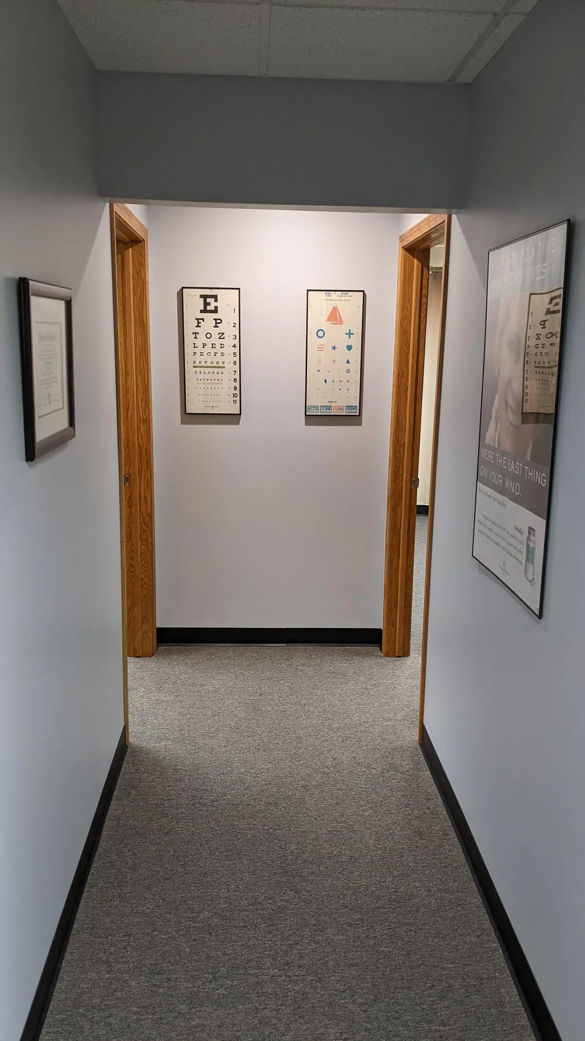 Warren Eye Care Center hallway with eye charts