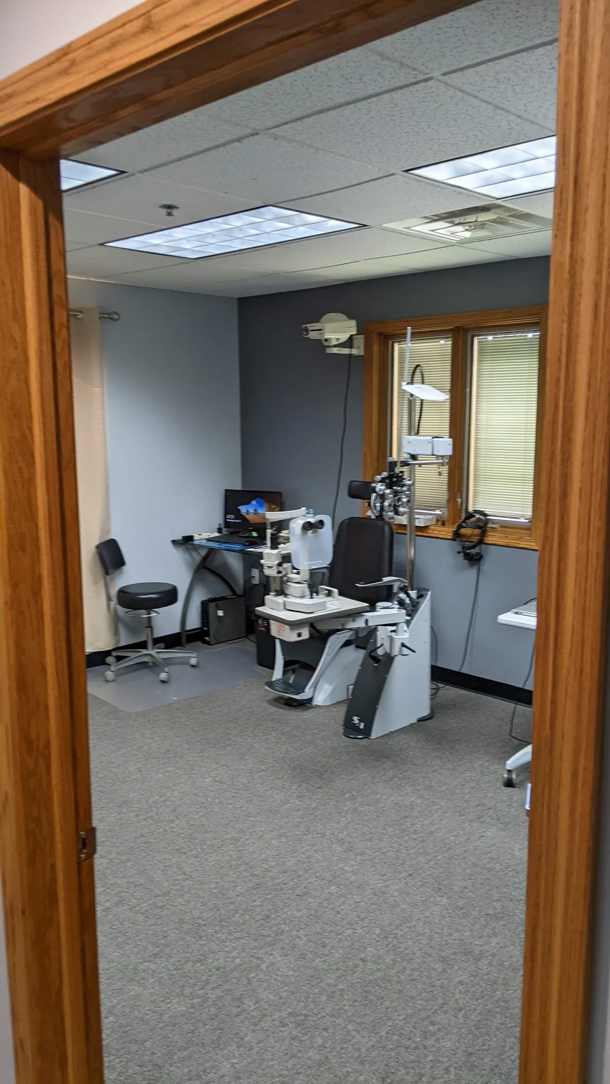Warren Eye Care Center exam room with eye exam equipment