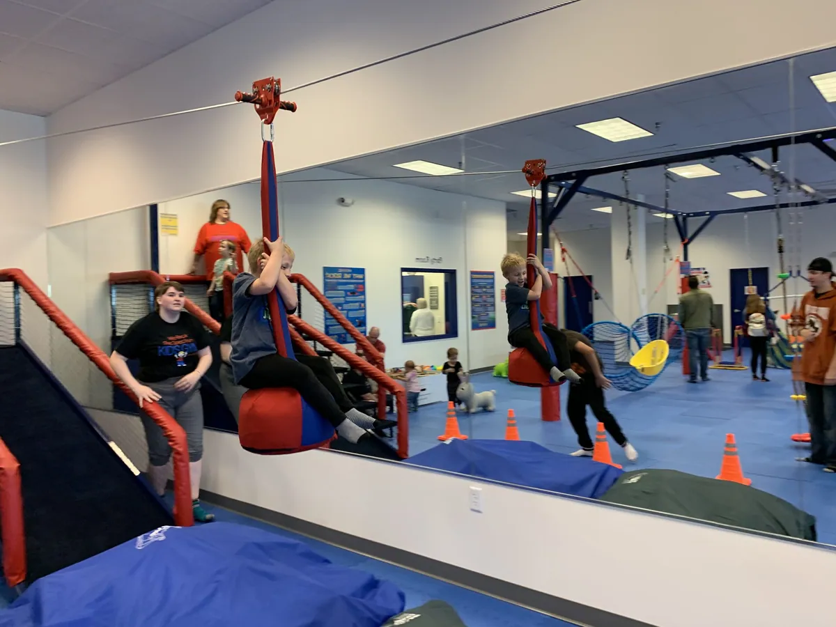 Children playing on sensory equipment at We Rock the Spectrum in Racine