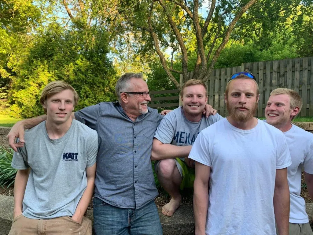 Herb Katt with his four sons outdoors