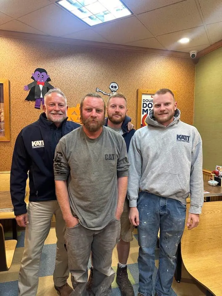 Herb Katt and his sons in Katt Construction shirts