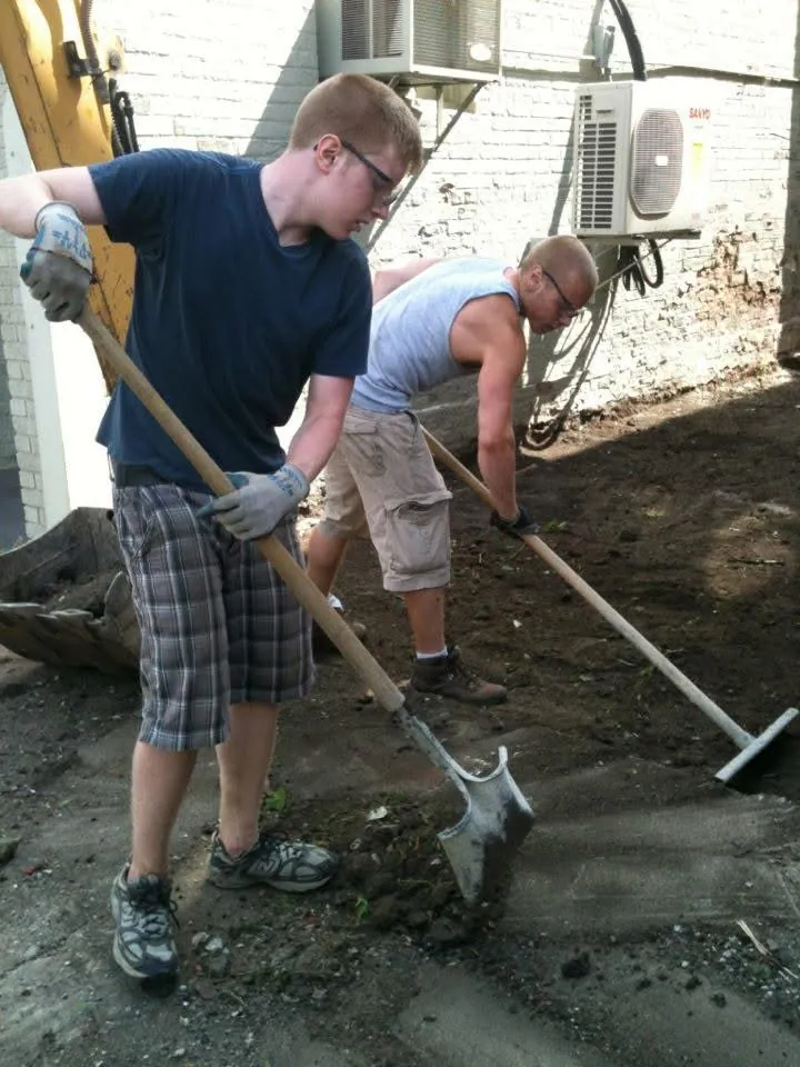 Two of the Katt sons digging on a job site