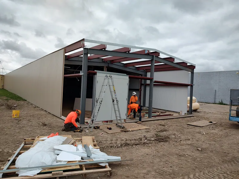 Workers framing the Racine Curling Club addition