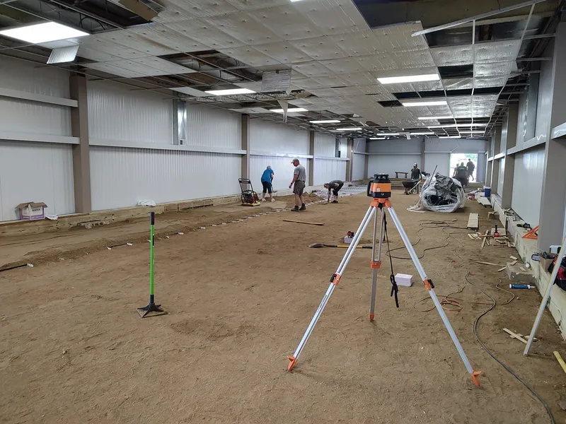 Laser level set up on the Racine Curling Club ice floor during renovation