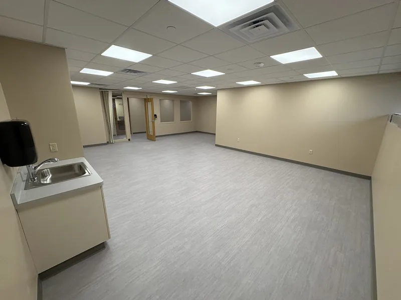 Renovated daycare room with new flooring and sink