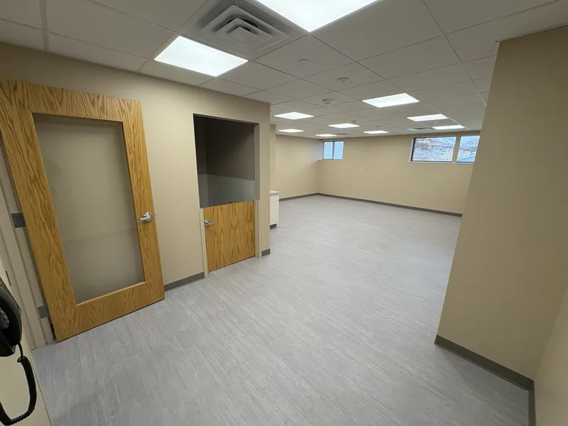 Renovated daycare room with new doors, flooring and lighting